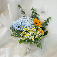 luxurious Sunflower, hydrangeas, mini daises in our lovely Encantador Bouquet suitable for birthdays and other celebratory occasions.